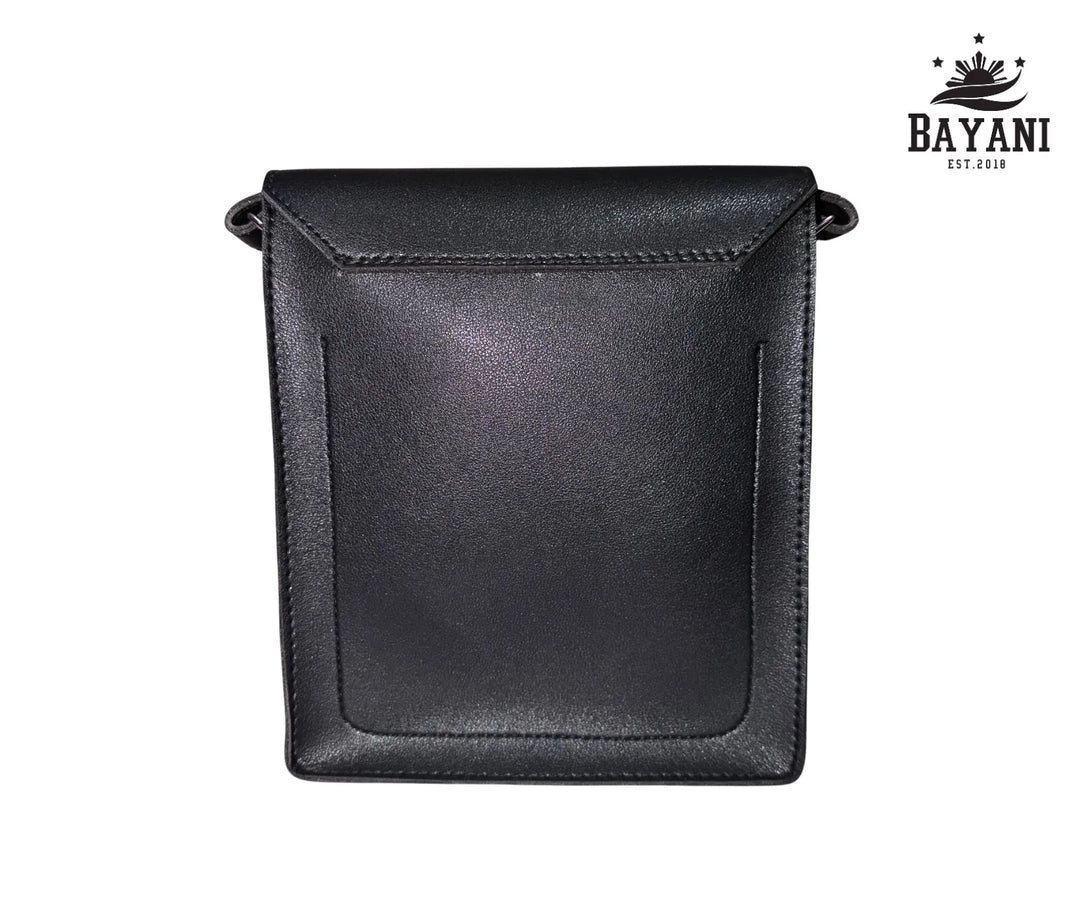 Black leather crossbody bag on a white background with Bayani logo.
