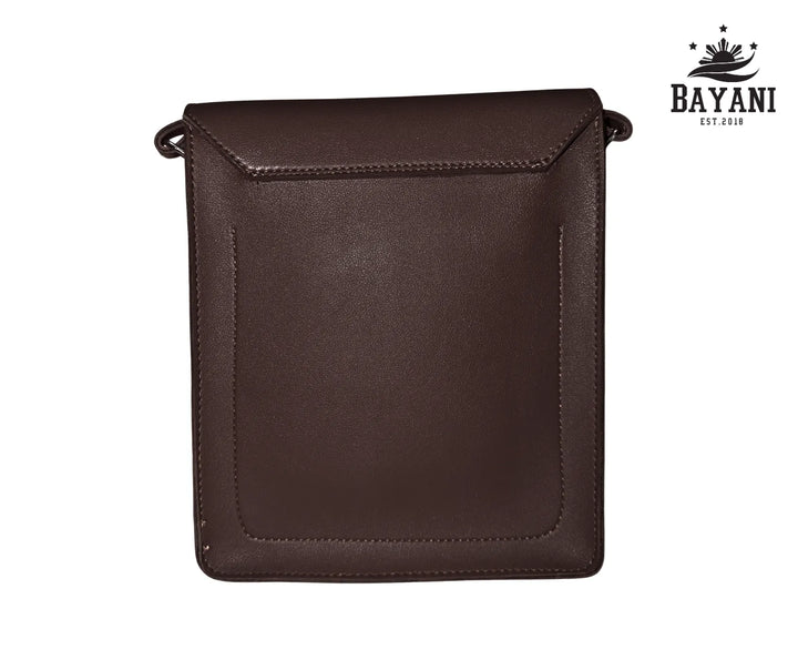 Brown leather crossbody bag on a white background with Bayani logo.
