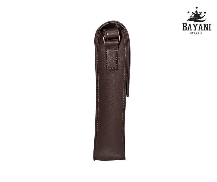 Brown leather crossbody bag on a white background with Bayani logo.
