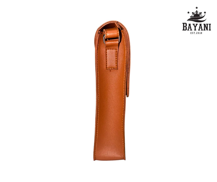 Brown leather crossbody bag on a white background with Bayani logo.
