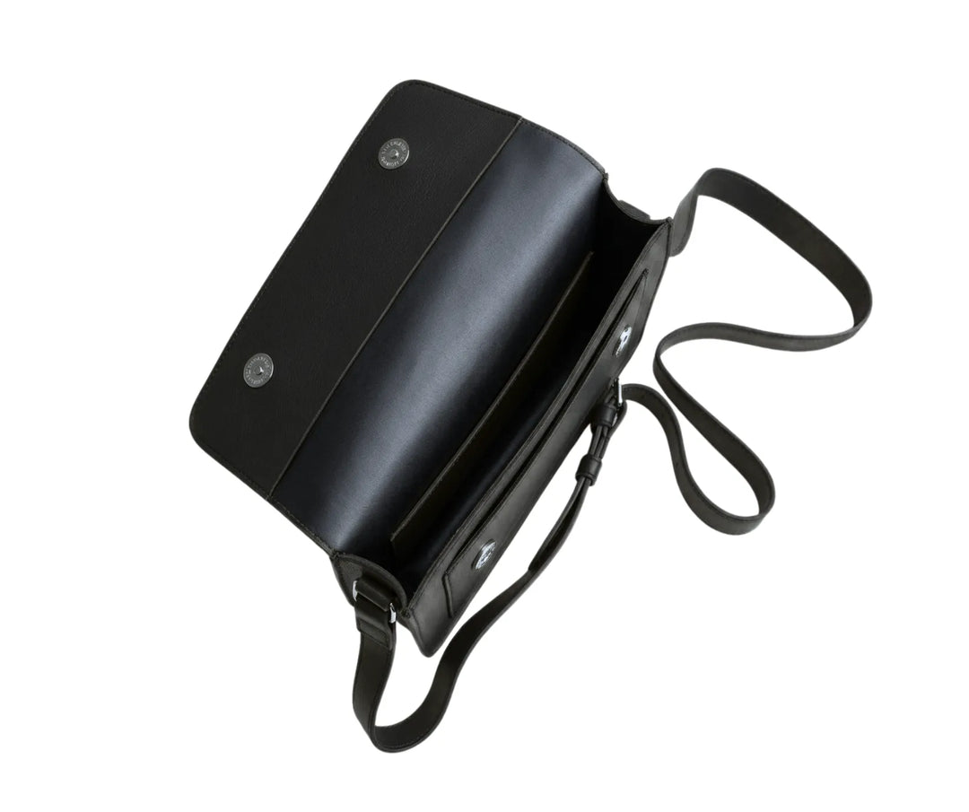 Black leather shoulder bag with a strap on a white background
