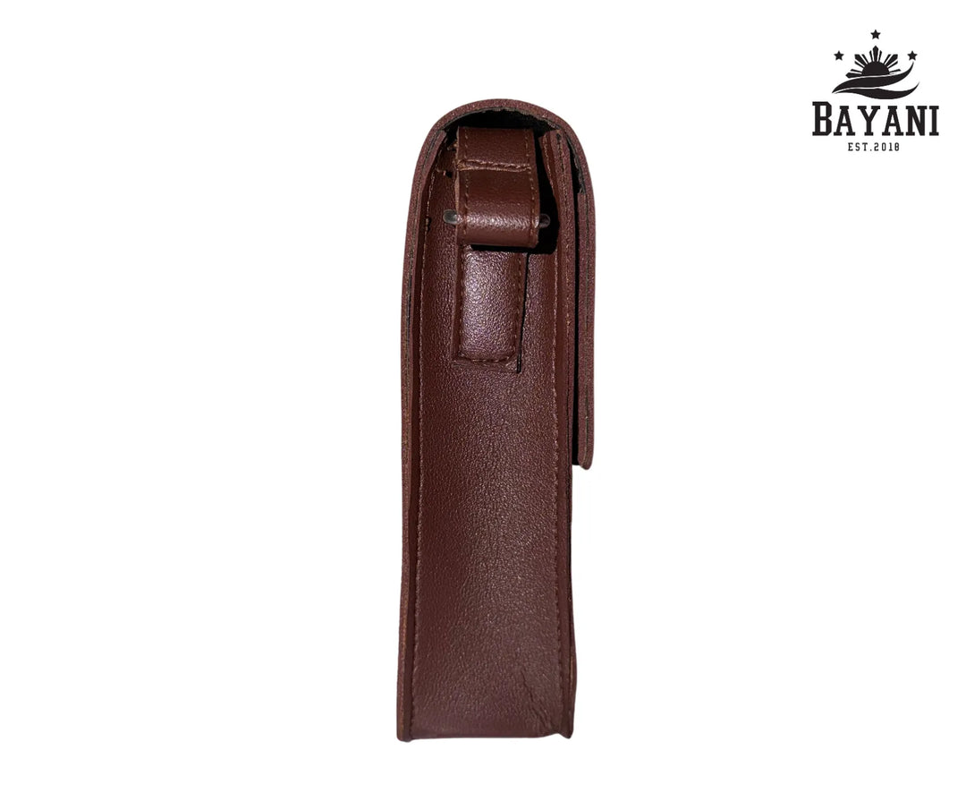 Brown leather pouch on a white background with Bayani logo.

