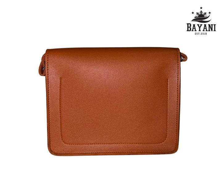 Brown leather handbag on a white background with Bayani logo.
