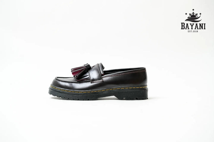 Black loafer shoe with a Bayani logo in the corner on a white background
