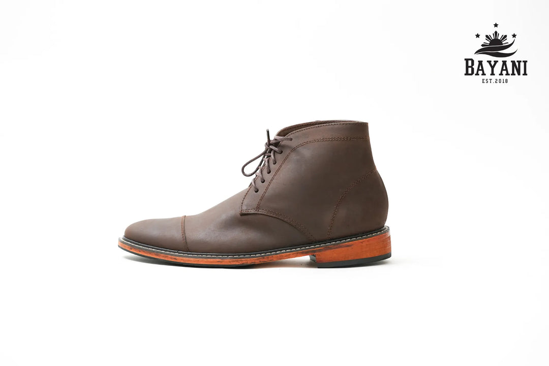 Brown leather shoe on a white background with Bayani logo.
