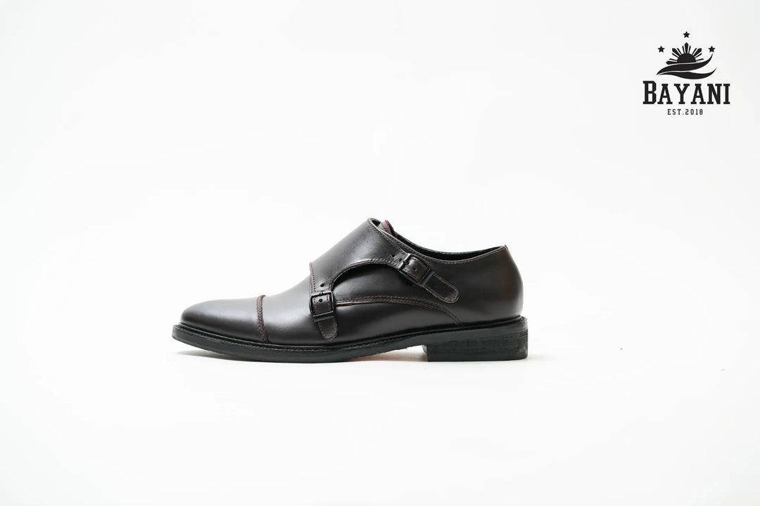 Black leather dress shoe with a Bayani logo on a white background

