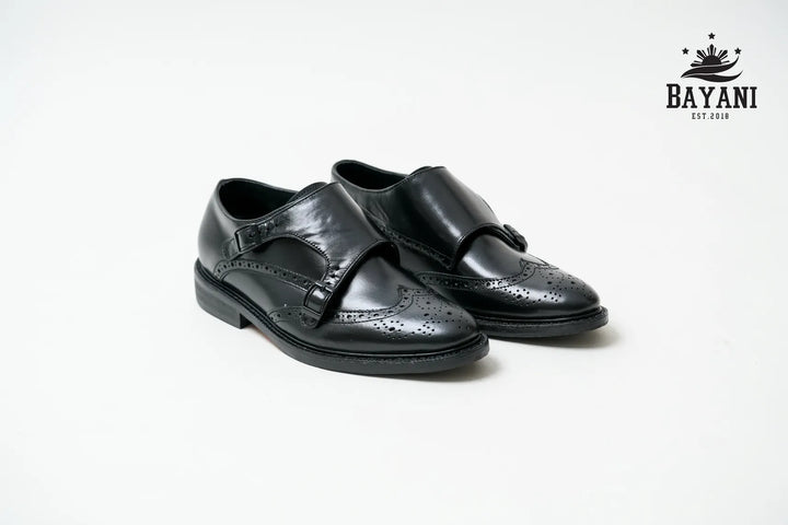 Black leather dress shoes on a white background with Bayani logo.

