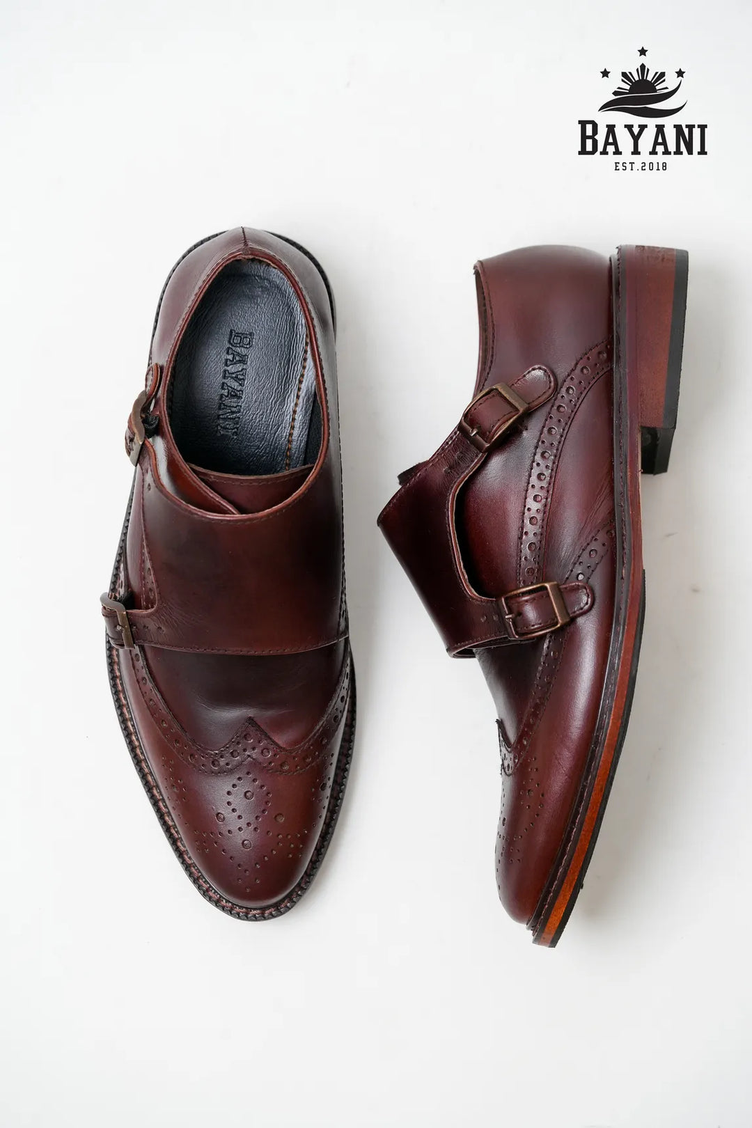 Brown leather shoes with a Bayani logo on a white background
