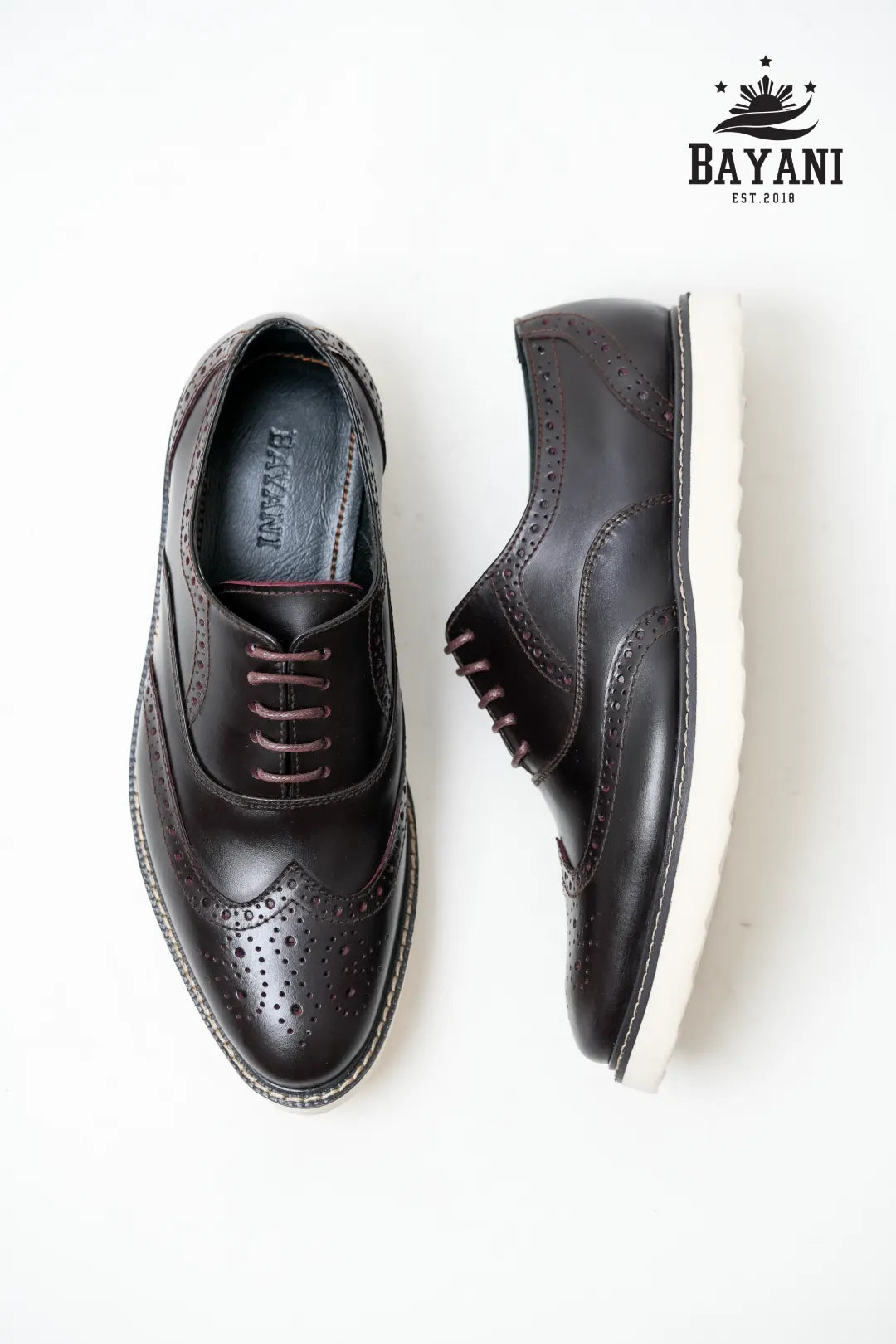 Pair of black dress shoes with &